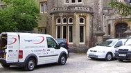 picture of a very large re-wired listed house with our vans in attendance